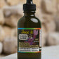 Bottle of 'Face it' skincare product with a dropper on a leafy background