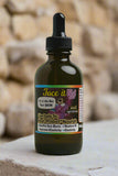 Bottle of 'Face it' skincare product with a dropper on a leafy background