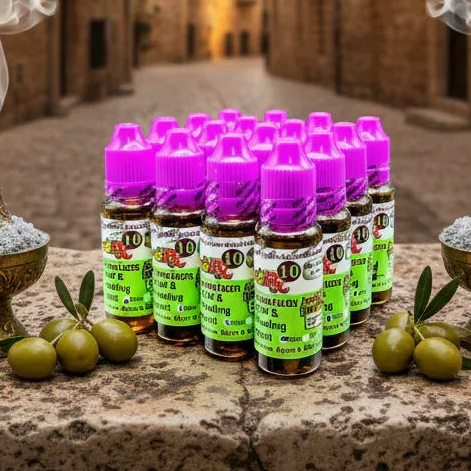 24 pack Rx10 Bible healing oils for sale on a stone with olives.