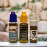 Three bottles of Kure-it products on a surface with a blurred background