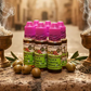 6 Bottles of biblical anointing oil with purple caps on a surface with olives and incense.
