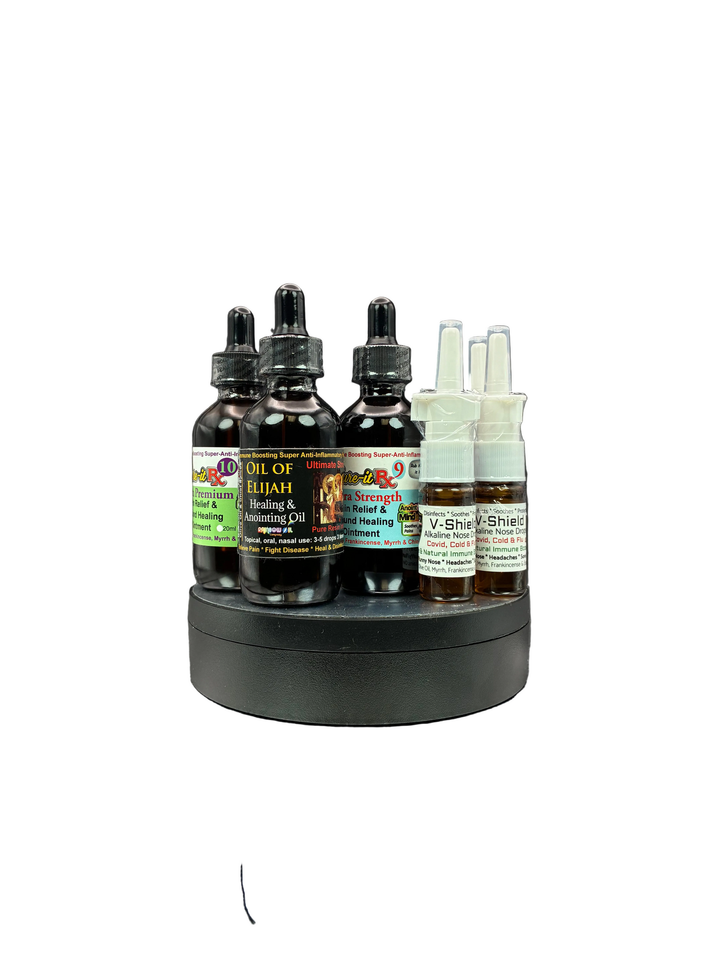 A set of dark amber dropper bottles and clear spray vials arranged on a round black stand against a plain white background. The labels show product names including Oil of Elijah, Healing & Anointing Oil, and V-Ghets.