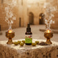 Rx10 Ultra Biblical Healing Oil for anointing with frankincense and myrrh burning on either side