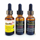 Three bottles of healing oils with labels on a white background