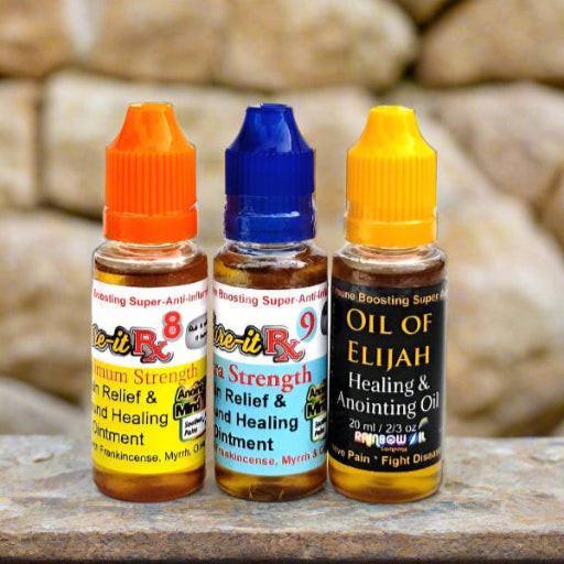 Three bottles of Kure-it anointing oil in different strengths: Oil of Elijah Ultimate Strength, Kure-it Rx9 Ultra, and Kure-it Rx8 Max Strength.